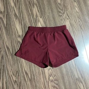 Old navy girls athletic shorts size L (10-12) in girls. Color is maroon/purple.
